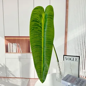 Grande foglia verde tropicale artificiale per decorazione di hotel e piante da soggiorno.