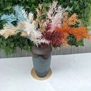 Artificial bamboo leaves bouquet, colorful floral arrangement for wedding home decor.