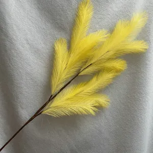 Artificial yellow pampas grass branch, long reed plant for wedding decor and home styling.