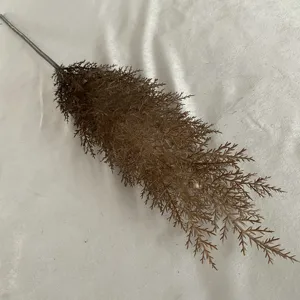 Detailed close-up shot of artificial brown plastic plant branch, perfect for home decor display.