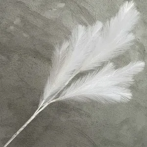 Detailed view of white artificial pampas grass branch, perfect for wedding and home decor.