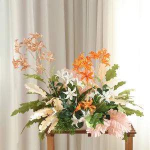 Artificial wild lily flower arrangement with mixed leaves for wedding decor and hotel photography.