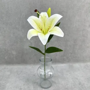 Artificial white lily flower stem detail in clear glass vase, perfect for home and wedding decor.