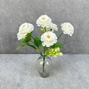 Artificial peony flower bouquet in glass vase, home wedding decor and photography prop.
