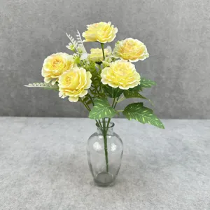 Artificial yellow peony flower bouquet with glass vase for home decor and party styling.