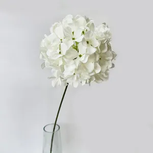 Detailed close-up view of a single artificial white hydrangea flower with dense petals.
