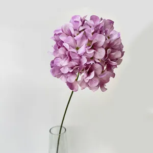 Artificial purple hydrangea flower detail closeup, single encrypted stem wedding arch decoration.