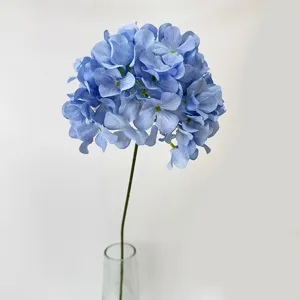 Close-up detail of artificial blue hydrangea flower stem, elegant floral decor accessory.