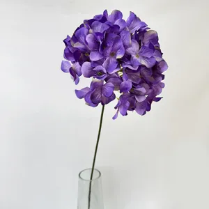 Detailed view of single purple artificial hydrangea flower close up for wedding and home decor.