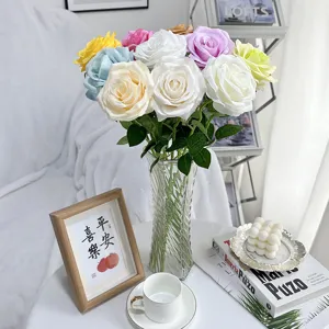 Artificial rose bouquet with transparent glass vase for home decor wedding floral arrangement.