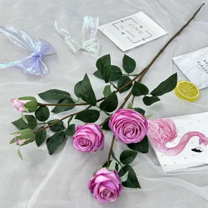 Artificial rose flower branch detail, multi-head fake floral arrangement for wedding home decor.