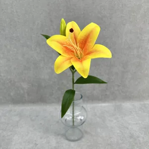 Detailed close-up view of a 3D printed artificial yellow lily flower displayed in a clear glass vase.