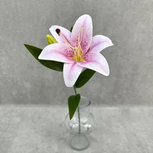 Close-up detail of realistic 3D printed artificial pink lily flower displayed in clear glass vase