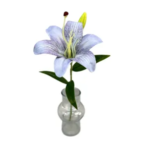 Single artificial lily flower with clear glass vase for wedding and home decoration.