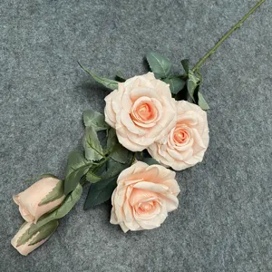 Close-up of the 5-head artificial rose bouquet showing realistic petals and green leaves for decor.