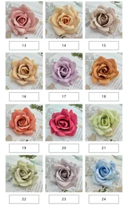 Artificial rose flower heads in multiple colors for wedding arch decor and floral arrangement details.