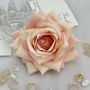 Artificial rose flower head detail, soft pink gradient silk flower for DIY craft decor.
