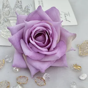 Purple artificial rose flower head close-up, perfect for wedding decor, DIY crafts and floral boxes.