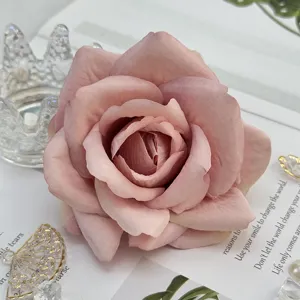 Artificial pink rose flower head for wedding home decor, premium faux floral arrangement.