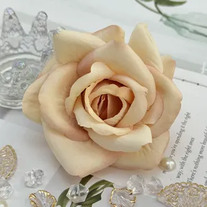 Artificial rose flower head, champagne pink fabric floral for wedding decor and DIY crafts details.