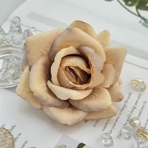 Detailed close-up of artificial champagne rose flower head for wedding arch and floral decor.