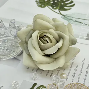 Artificial green rose flower head close up detail shot for floral arrangement decor