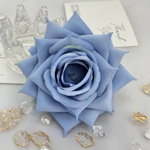 Closeup of blue artificial rose flower head, perfect for wedding decor, DIY crafts, and floral boxes.