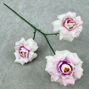Artificial rose flower detail showing petals and stem structure, soft pink and white gradient.