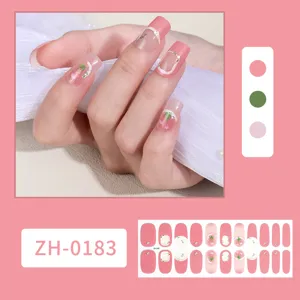 Detail view of waterproof pink nail stickers with tulip pattern and rhinestones, easy application.