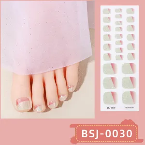 Semi-cured gel toe nail wraps featuring glitter gradient design for elegant pedicure.