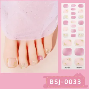 Semi-cured gel toenail wraps with pink gradient and gold foil detail, ideal for salon styling.
