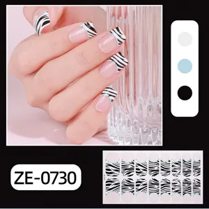 French zebra print press on nail wraps set with blue line detail and color swatches display.