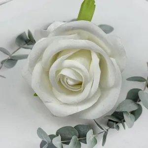 White velvet artificial rose head with eucalyptus leaves, perfect for wedding and home decor.