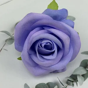 Detail shot of artificial purple rose flower head for wedding decoration photography props