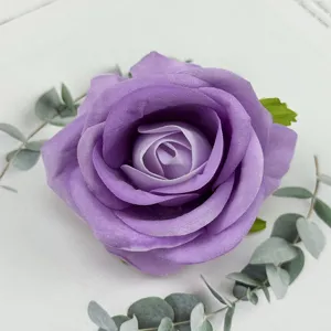Purple velvet artificial rose flower head detail shot, ideal for wedding party decoration.