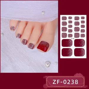 Red glitter toenail stickers detail view showing gorgeous sparkle gradient design patterns.