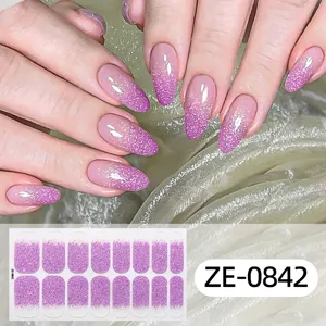Detail shot of gradient glitter nail wraps showing sparkling purple sparkle and texture.