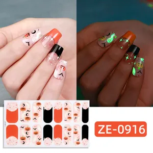 Halloween glow-in-the-dark nail wraps featuring cute ghosts and pumpkins for spooky style.