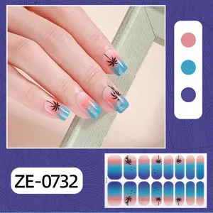 Detailed view of summer gradient nail wraps featuring palm tree and sea bird patterns.