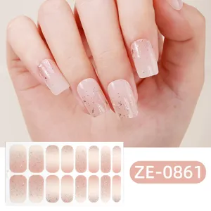Close-up of pink gradient nail wraps featuring sparkling silver glitter and foil details.