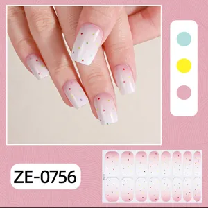 Detailed view of french gradient polka dot nail wraps showing colorful dot patterns on fingernails.