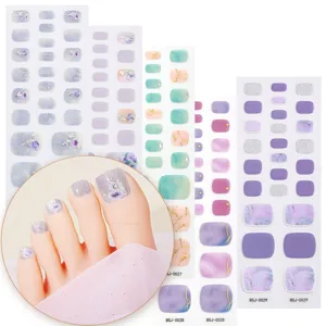 Semi-cured gel toe nail strips with elegant marble and floral designs for summer.