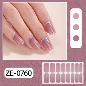 Close up details of the 16 finger french gradient glitter nail wraps with elegant pink shade.