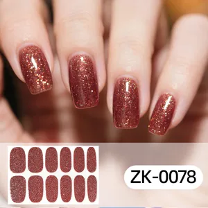 Close-up detail of glitter brown nail stickers showing sparkling texture and smooth finish.