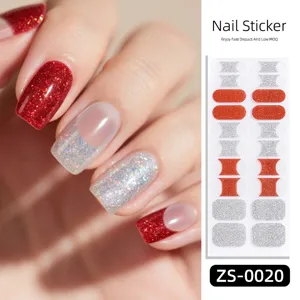 Close-up detail showing red and silver glitter French nail stickers worn on model fingers.