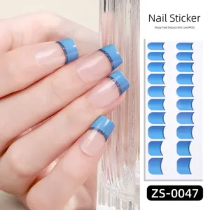 Detail view of blue French tip gel nail stickers with glitter line, 20 tips double row adhesive.