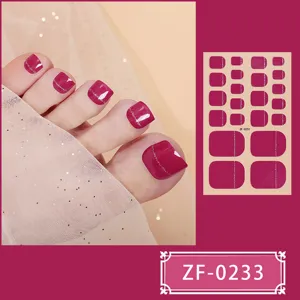 Detailed view of solid color glitter line toe nail wraps showing application and full sheet.