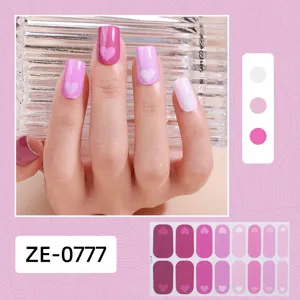 Valentine heart nail wrap detail shot showing pink gradient manicure sticker design closely.