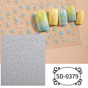 Detailed view of 5D embossed blue floral nail art stickers with elegant gradient yellow tips.