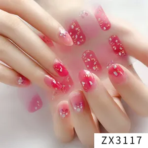Close up detail of pink gradient glitter nail wraps sticker showcasing exquisite manicure art.